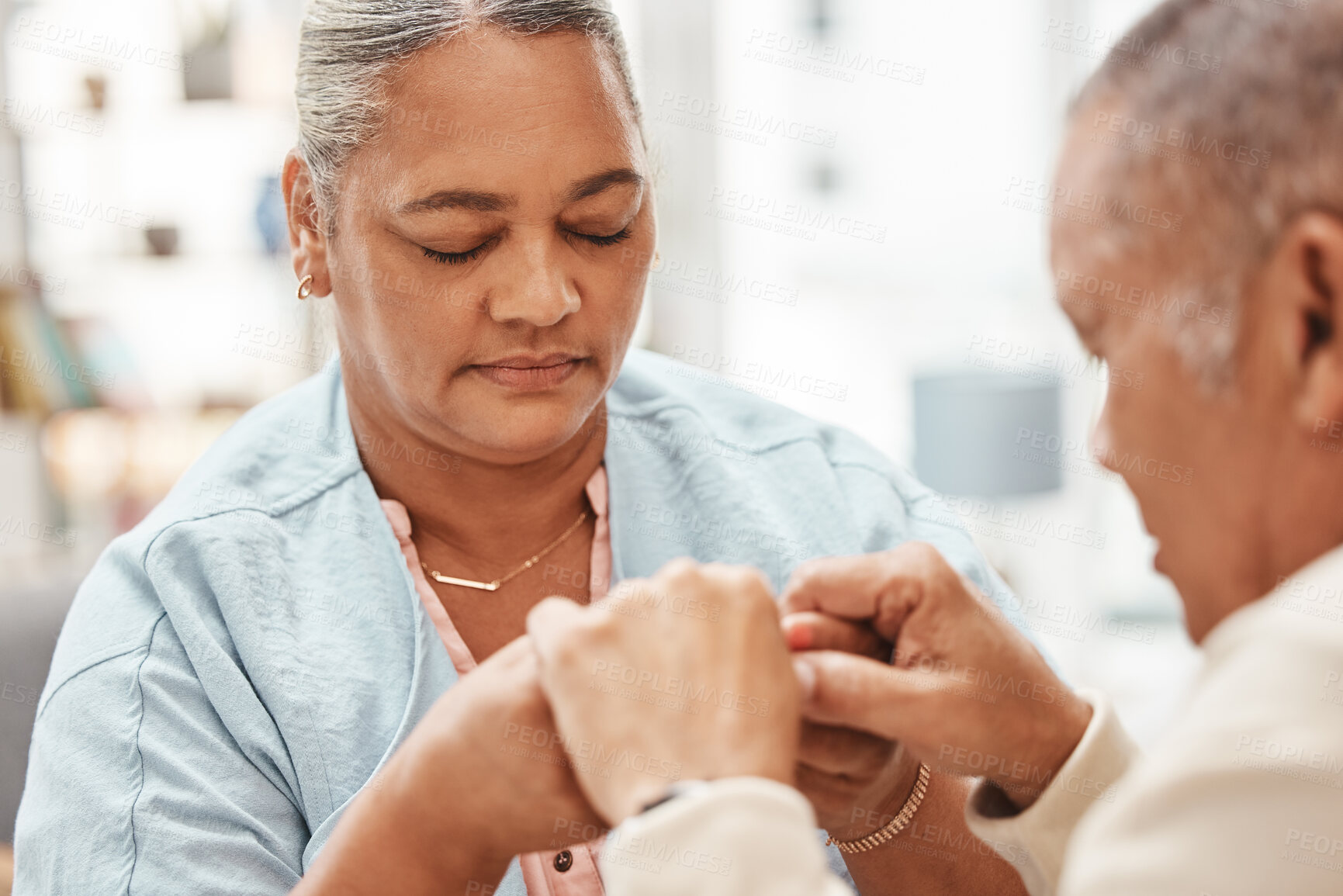 Buy stock photo Worship, praying or old couple love holding hands together in a Christian home in retirement with hope, belief or faith. Jesus, senior man and woman with peace in prayer to God for spiritual bonding