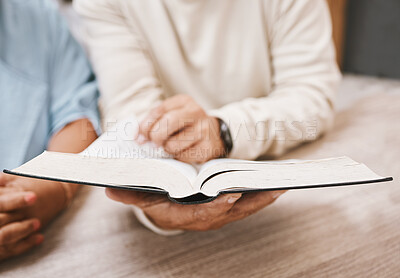 Buy stock photo Hands, bible and prayer with a senior couple reading a book together in their home during retirement. Jesus, faith or belief with a man and woman praying to god in their house for spiritual bonding