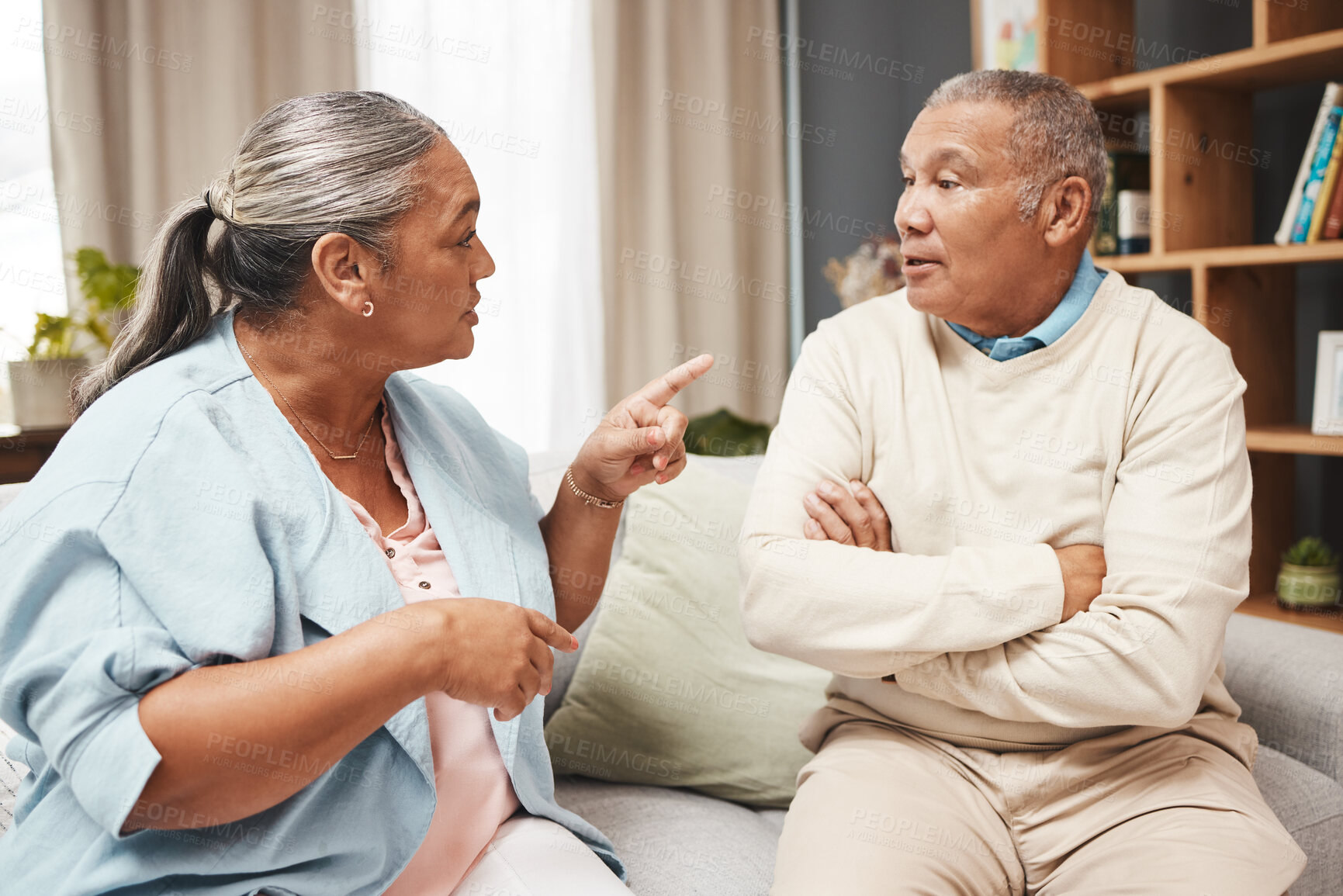 Buy stock photo Senior couple, fight and angry on sofa for marriage problems, conflict and communication. Divorce, argument and frustrated partner of man, woman and people in anger, living room and blame of affair