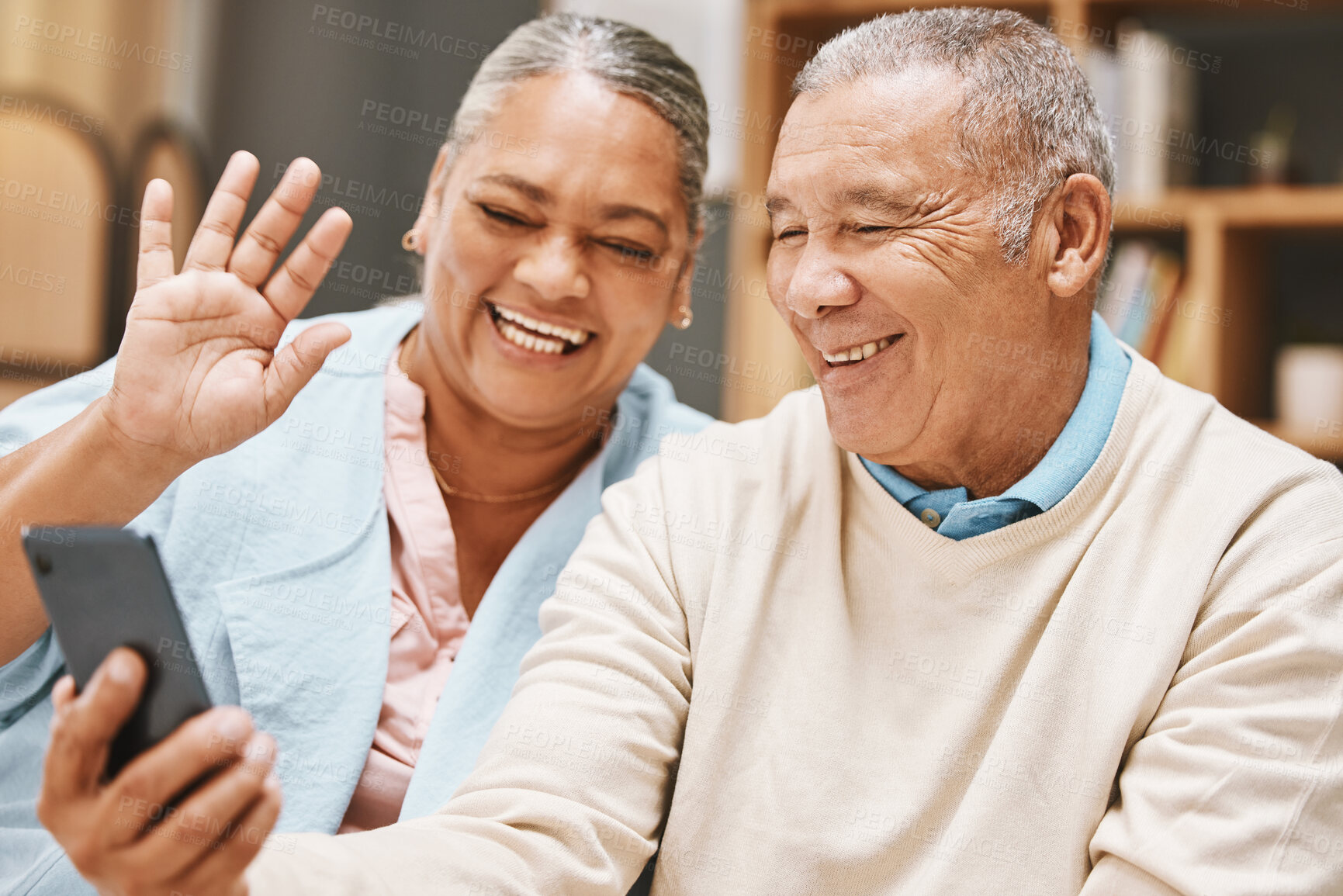 Buy stock photo Video call, wave or old couple talking, communication or speaking in conversation in retirement at home. Partnership, elderly man or happy senior woman greeting online on phone together with smile