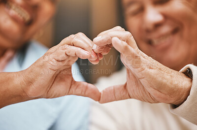 Buy stock photo Love, heart hands or happy old couple with support, trust or hope in a marriage commitment at home.  Romance, valentines day or senior man smiles with an elderly woman relaxing on anniversary 
