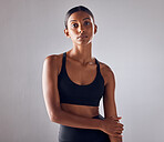 Portrait, fitness and young woman isolated on studio background for health, wellness and training mockup. Confident indian person, athlete or model with sports fashion, workout and exercise for body