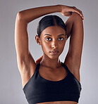 Exercise, face portrait and woman stretching for cardio fitness running, marathon training or body healthcare goals. Performance workout, studio health or athlete warm up isolated on grey background