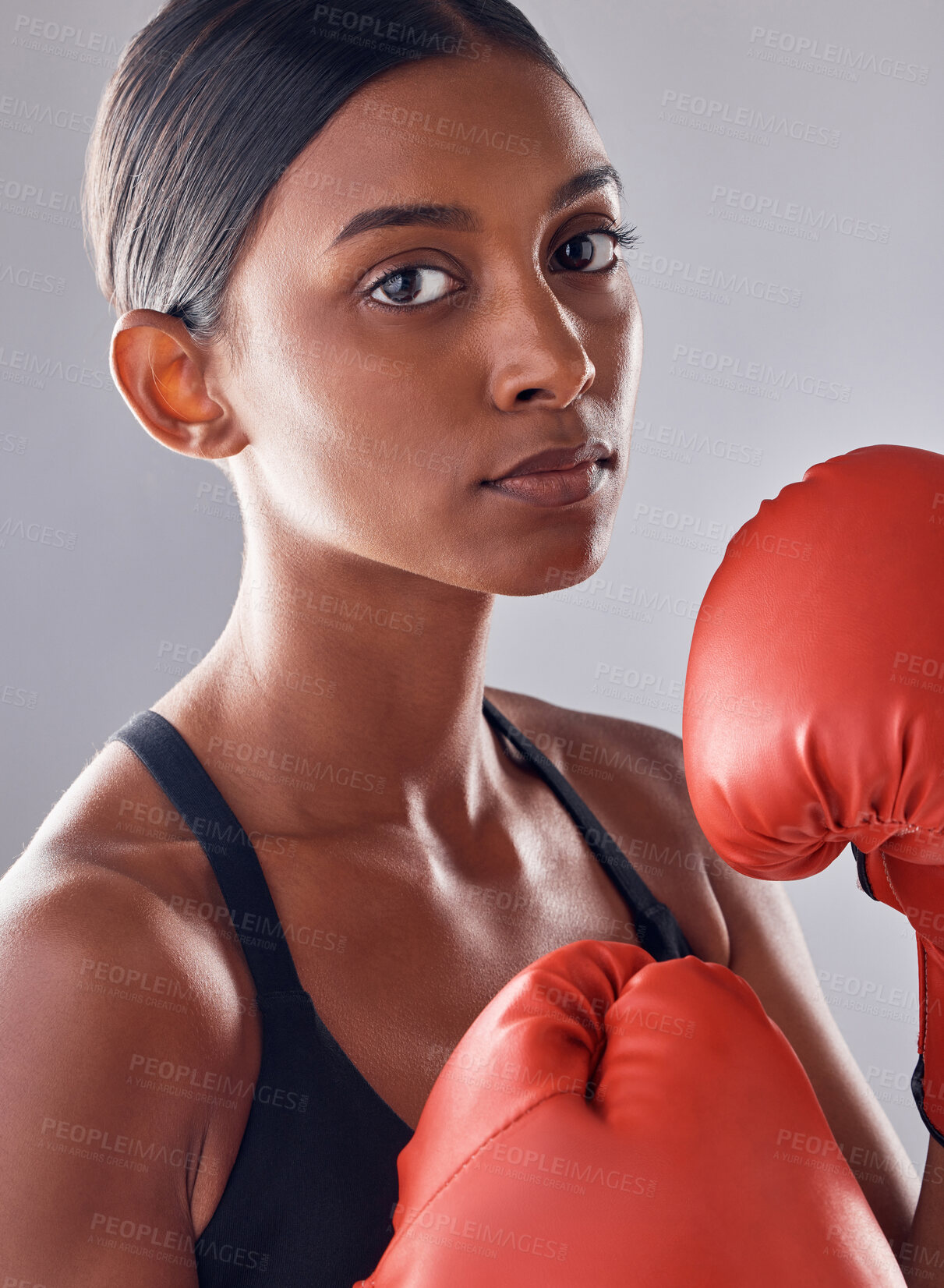 Buy stock photo Boxer, gloves and portrait of woman in studio for sports exercise, strong muscle or mma training. Indian female, boxing workout and fist fight for impact, energy and warrior power in battle challenge