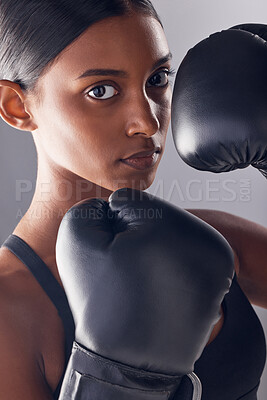 Buy stock photo Boxing hands, gloves and portrait of woman in studio for sports, strong muscle or mma exercise. Female boxer, workout and fist fight of warrior, energy or fitness power in battle, challenge or action