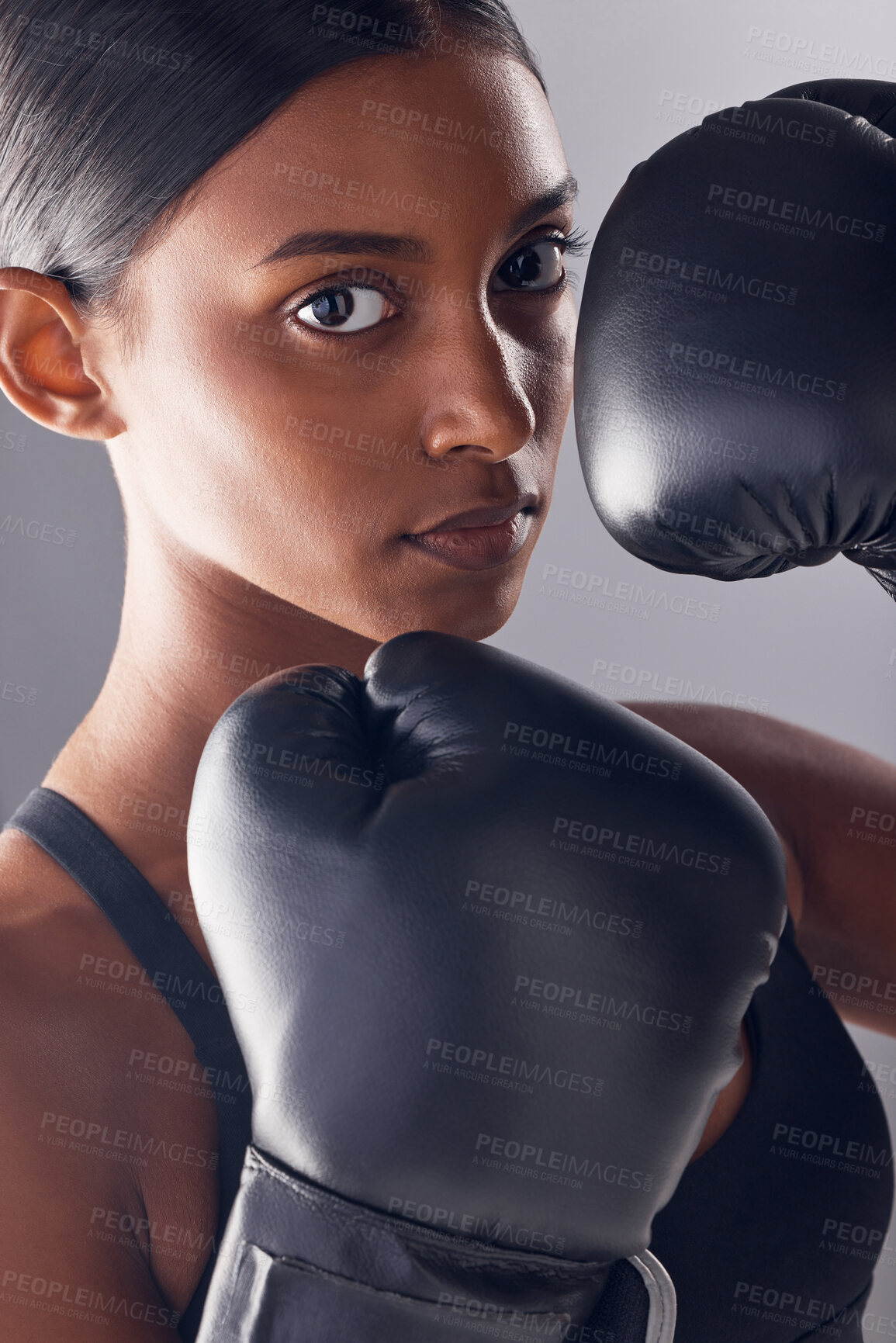 Buy stock photo Boxing hands, gloves and portrait of woman in studio for sports, strong muscle or mma exercise. Female boxer, workout and fist fight of warrior, energy or fitness power in battle, challenge or action