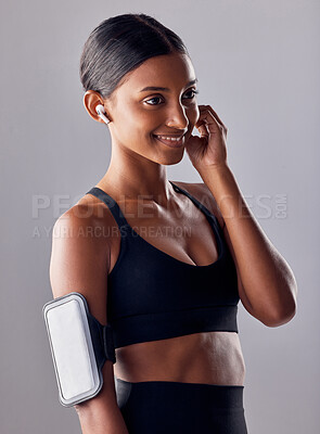 Buy stock photo Studio, fitness and woman with music in exercise, wellness or advertising on grey background space. Workout, mockup and girl relax with podcast, audio or track for motivation while training isolated