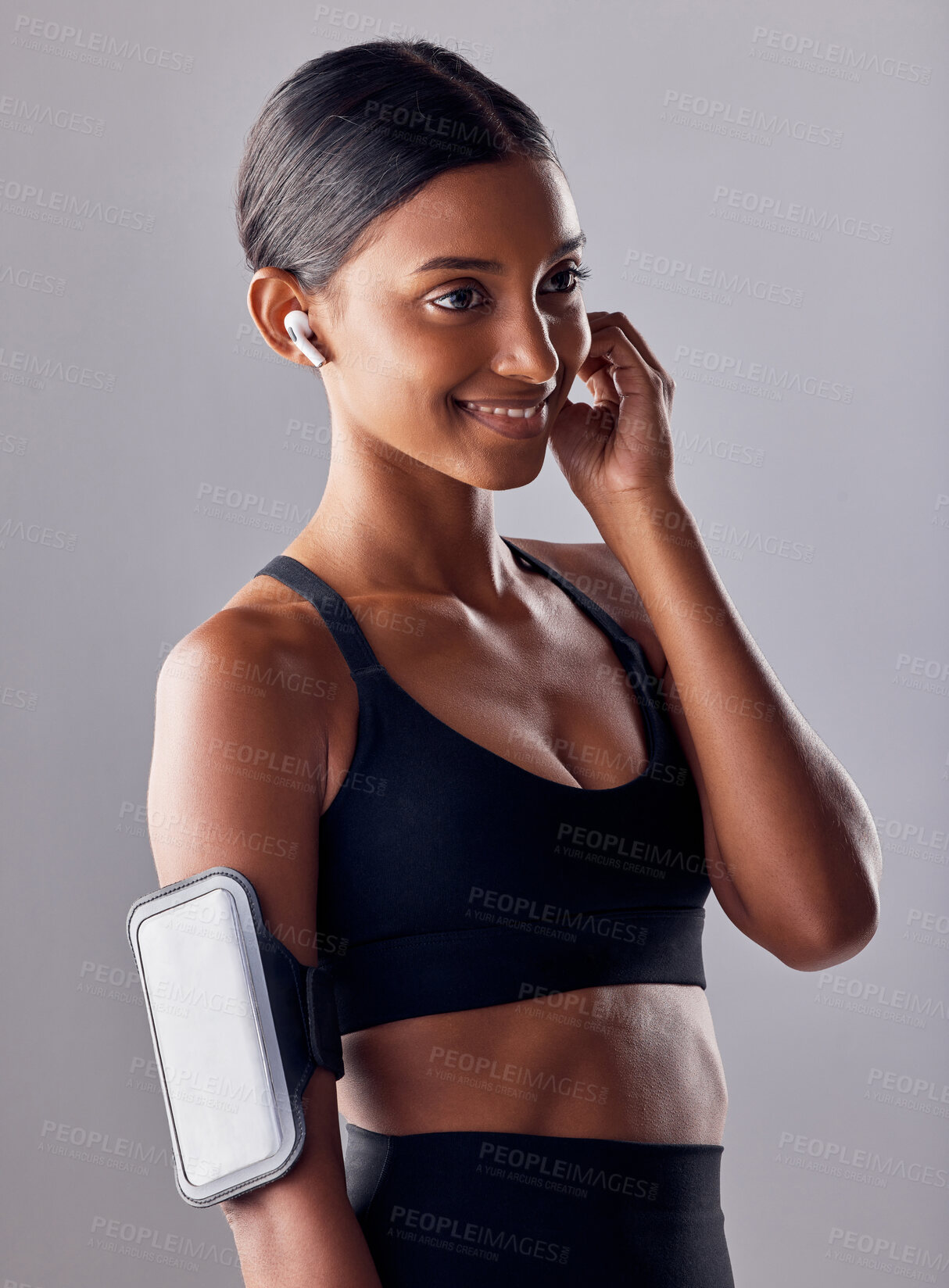 Buy stock photo Studio, fitness and woman with music in exercise, wellness or advertising on grey background space. Workout, mockup and girl relax with podcast, audio or track for motivation while training isolated