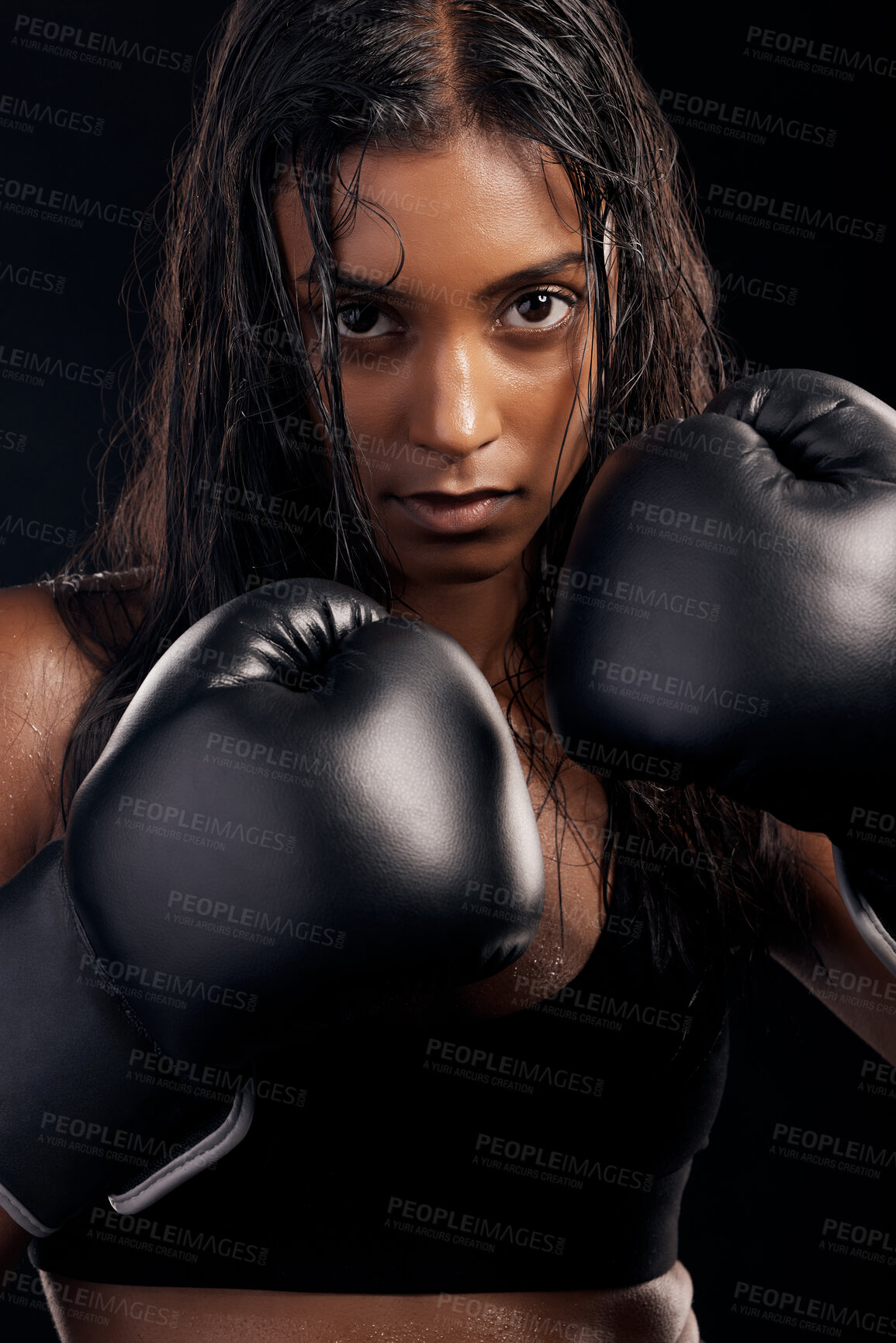 Buy stock photo Boxing, gloves and portrait of woman on black background for sports, strong focus or mma training. Female boxer, workout or fist fight of impact, energy and warrior power for studio fitness challenge