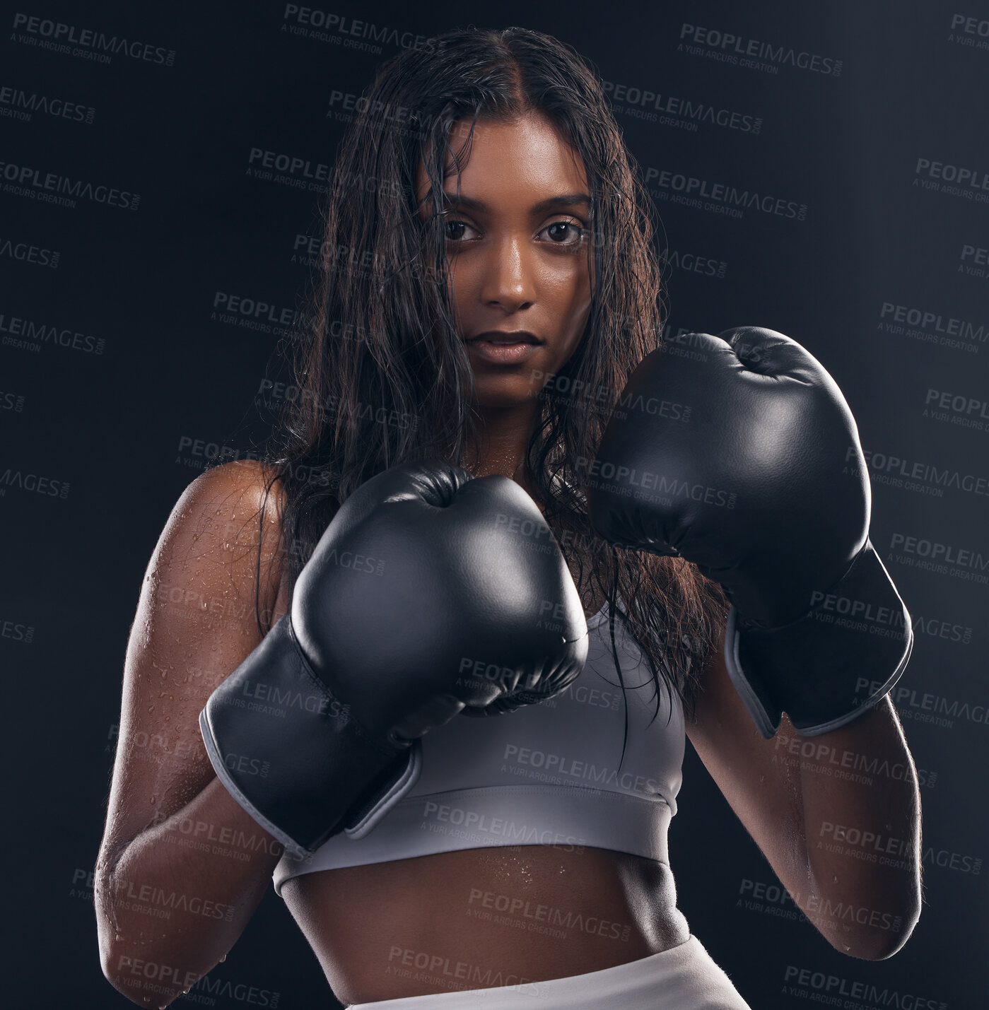 Buy stock photo Boxing champion, portrait and woman on black background for sports, strong focus and mma training. Female boxer, gloves and fist fight of impact, energy and warrior power for studio fitness challenge