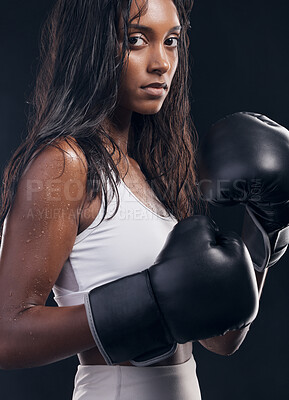 Buy stock photo Boxer champion, woman and portrait on black background for sports, strong focus or mma training. Female boxing, gloves and fist fight in studio, impact and warrior energy for power of fitness workout