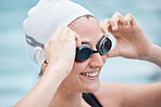 Training, sports or happy woman in swimming pool or water for practice, workout or body fitness. Wellness, smile or healthy girl athlete in goggles exercising for cardio, endurance or exercise goals