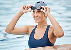 Swimming pool, sports and face of woman swimmer ready for training, water polo game and exercise in gym. Fitness, wellness and happy female athlete smile for competition, workout and race challenge