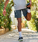 Stretching, fitness and legs of a man in nature for running, exercise and training in Morocco. Marathon, workout and back of an athlete with a warm up to start cardio, race or sports in a park