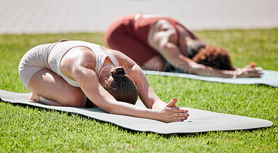 Buy stock photo Fitness, woman and yoga on grass for spiritual wellness, healthy exercise or stretching on mat in nature. Women, friends and yogi in warm up stretch class for zen workout, relax or pilates for peace