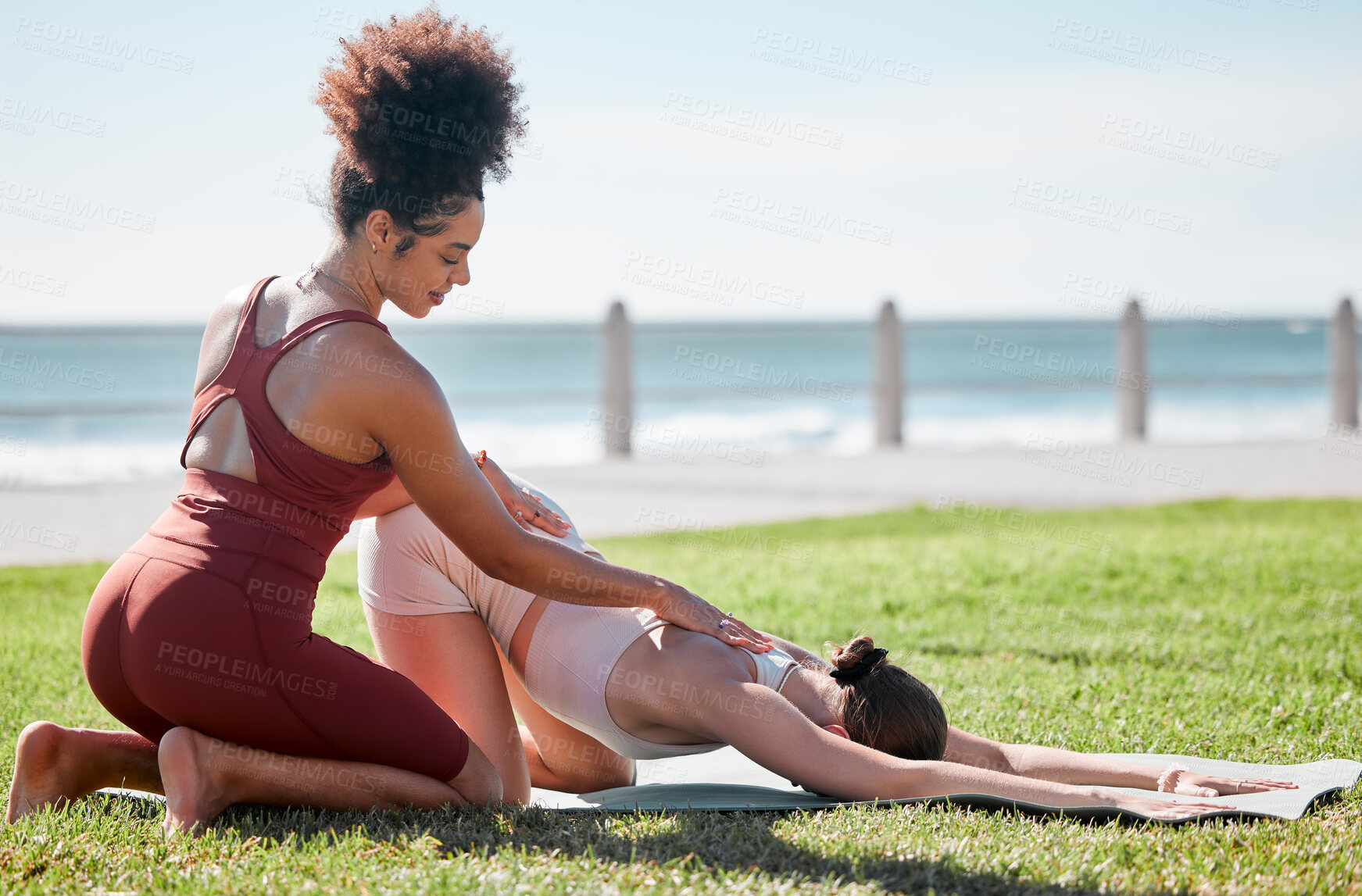 Buy stock photo Help, fitness and women doing yoga at park for a warm up, exercise and stretching support in Spain. Health, training and personal trainer with a girl for flexibility during pilates workout in nature