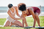 Yoga, personal trainer or women support, helping and learning balance, training and exercise on beach or park. Mentor with black woman or client in pilates workout on grass sports for body wellness