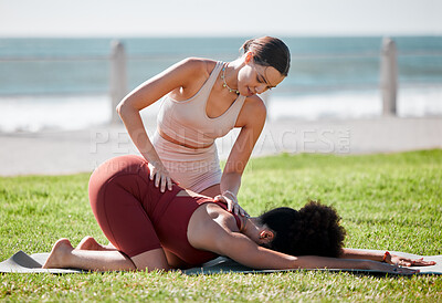 Buy stock photo Help, training and women doing yoga at a park for fitness, exercise and stretching support in Spain. Health, warm up and personal trainer with a girl for flexibility during pilates workout in nature