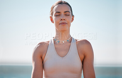 Buy stock photo Woman, face and meditation at beach for calm, spiritual freedom and breathe in nature. Young female, zen and eyes closed at ocean for balance mindset, fitness and yoga exercise at sea, relax or peace