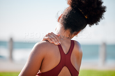 Buy stock photo Medical, shoulder pain and fitness with black woman at beach for yoga, workout and exercise training. Burnout, injury and physical therapy with girl in city park for health, sport and pilates goals