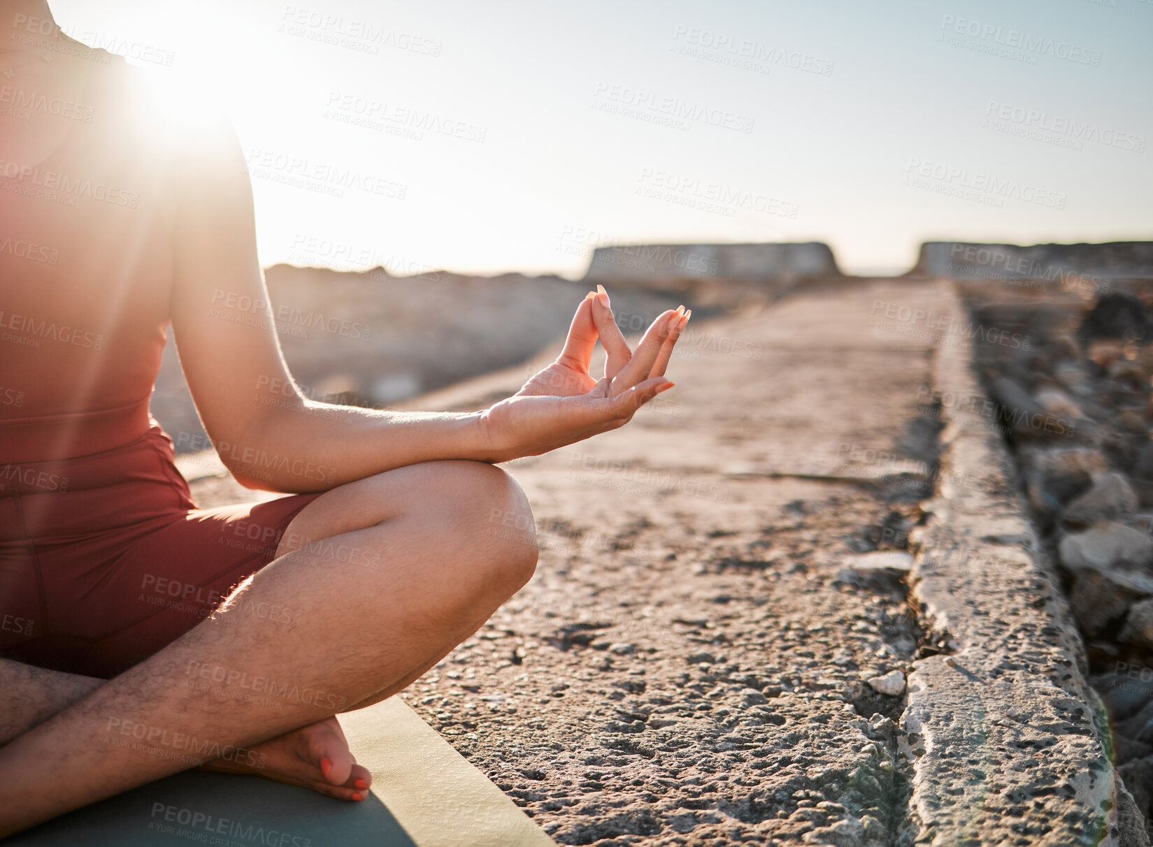 Buy stock photo Woman, hands and meditation in yoga on rock for spiritual wellness or peaceful exercise in nature. Hand of female yogi in calm meditating for zen workout, relax or awareness by ocean coast on mockup