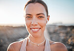 Portrait, fitness and music with a sports woman outdoor, standing against a mockup sky background. Face, exercise and wellness with a female athlete cardio or endurance training alone outside