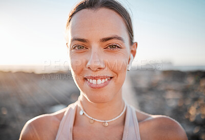 Buy stock photo Portrait, fitness and music with a sports woman outdoor, standing against a mockup sky background. Face, exercise and wellness with a female athlete cardio or endurance training alone outside