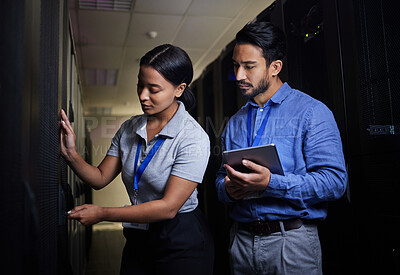Buy stock photo Engineer teamwork, server room and woman opening panel for maintenance or repairs at night. Cybersecurity, programmers and female with man holding tablet for software or networking at data center.