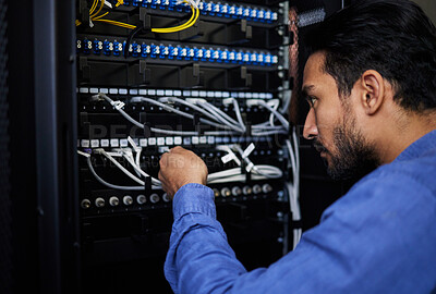 Buy stock photo Engineer, server room and man with cable connection for software update or maintenance at night. Information technology wire, cloud computing and male programmer check database network in data center
