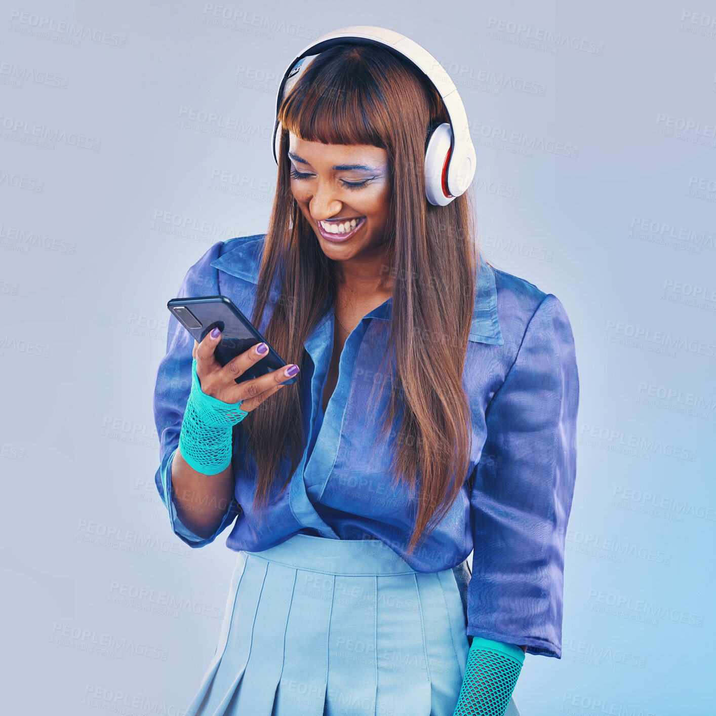 Buy stock photo Phone, music and fashion with a model black woman in studio on a gray background for contemporary style. Social media, happy and edgy with a trendy person streaming or listening to audio inside