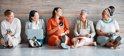 Buy stock photo Collaboration, technology and communication with a business team sitting on the floor in their office for work. Teamwork, diversity and corporate design with a woman employee group working together