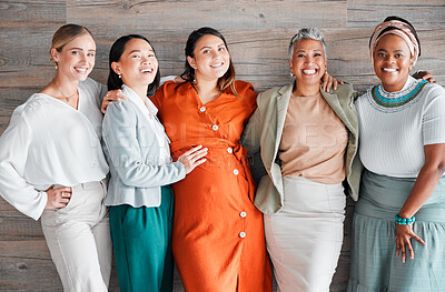 Buy stock photo Happy, friends and portrait of a pregnant female with women by a wood wall at her baby shower. Friendship, diversity and group of ladies supporting, loving and bonding with pregnancy together.