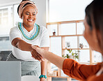Creative woman, handshake and smile for b2b, partnership or greeting in hiring at office. Happy African American female designer shaking hands of employee, colleague or intern in trust for startup
