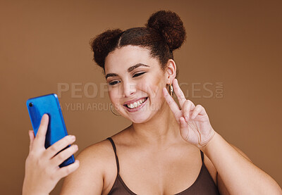 Buy stock photo Selfie, peace sign and black woman with phone feeling excited, happy and beauty for profile picture. Social media, isolated and studio background with mockup of gen z, young and face of a model