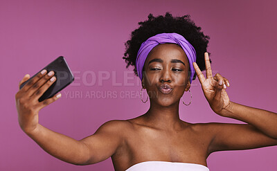 Buy stock photo Phone, selfie and face of woman with peace sign on purple background for wellness, fashion and cosmetics. Beauty, skincare and happy girl influencer on smartphone for social media, picture and post