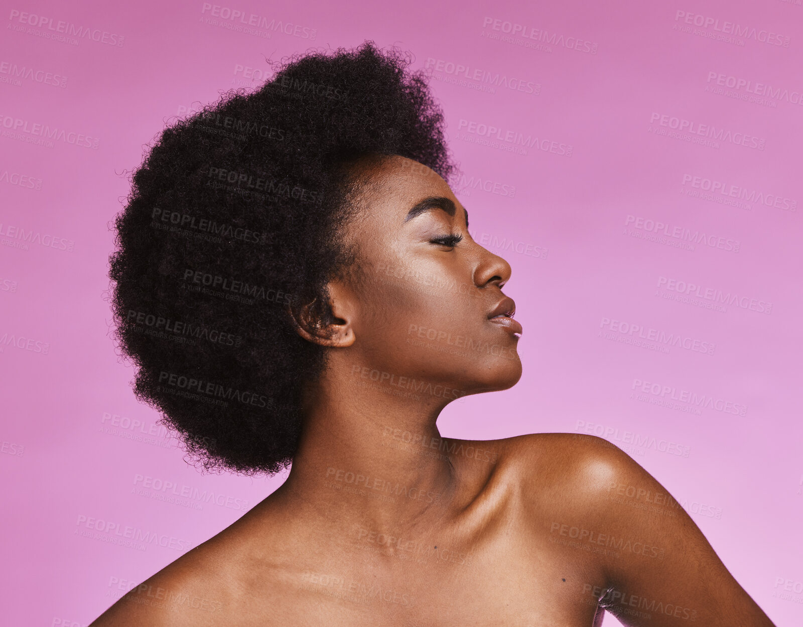 Buy stock photo Black woman, afro beauty and skincare on pink background for aesthetic facial, cosmetics and glow. Young african, studio model and curly hair for dermatology, wellness and laser salon transformation