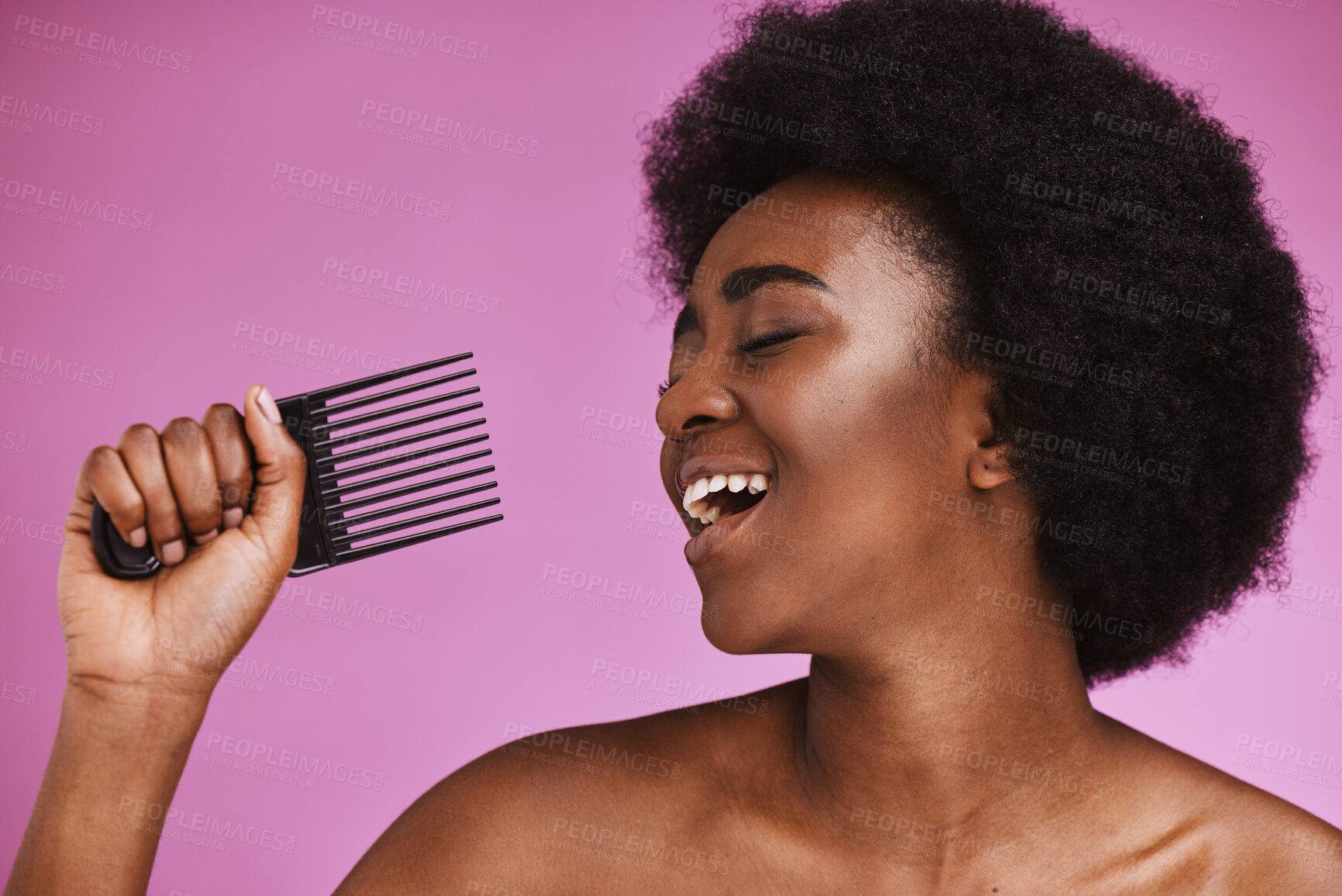 Buy stock photo Singing, hair or afro comb on beauty background in fun grooming routine, natural skincare play or growth texture karaoke. Black woman, happy or hairstyle brush microphone on isolated pink performance