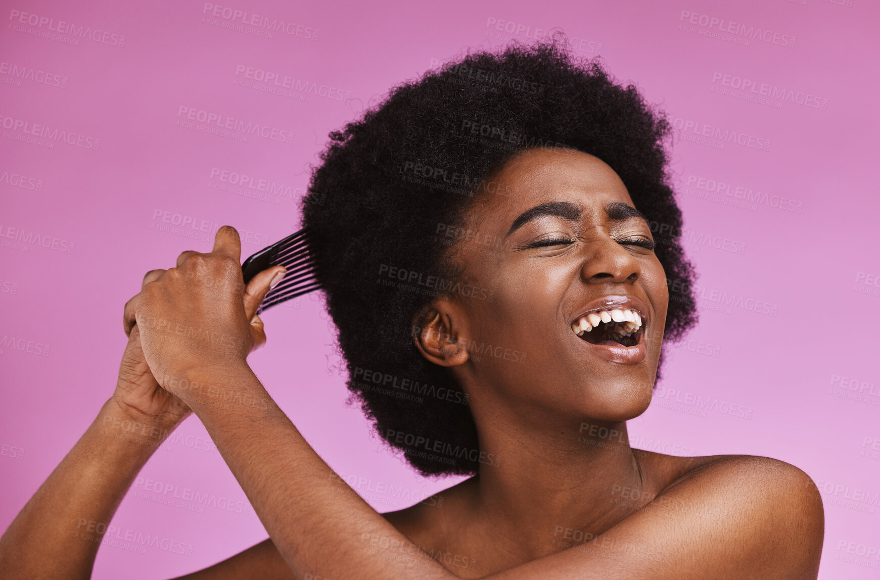 Buy stock photo Stress, hairstyle and afro brushing on beauty studio background in grooming, texture anxiety or crisis. Black woman, comb and natural hair with damage, split ends or frizzy knots on isolated skincare