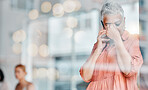 Stress, headache and phone call of senior woman feeling pain, tired or exhausted. Bokeh window, mental health or elderly female with depression, anxiety or migraine while talking on mobile smartphone