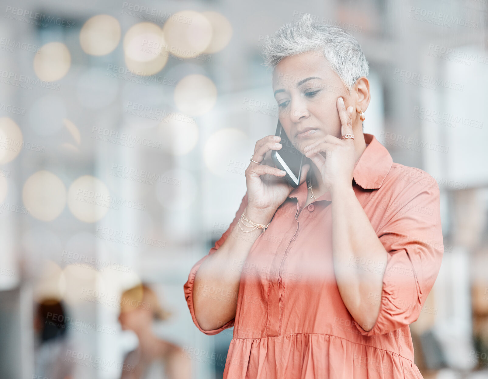 Buy stock photo Phone call, sad and senior business woman talking, chatting or speaking in workplace. Bokeh window, communication and elderly female with depression, networking or discussion on mobile smartphone.