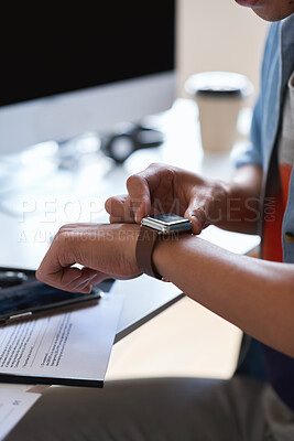 Buy stock photo Technology, communication and businessman with smartwatch on arm at desk, mobile app and digital access to work network. Freelance worker checking time, online schedule or message on watch in office.