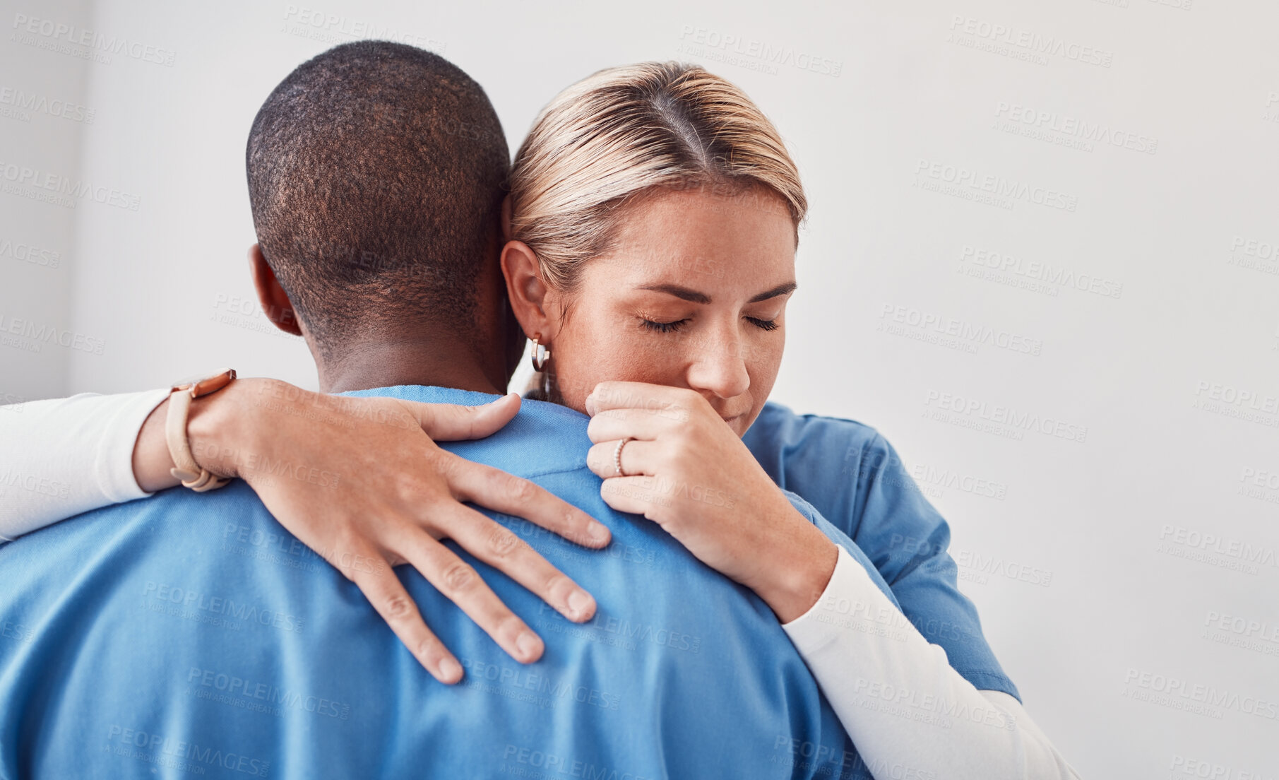 Buy stock photo Comfort, support and doctors hugging in the hospital after the death of a patient in surgery. Healthcare, sad and medical workers embracing with care, love and compassion in the medicare clinic.
