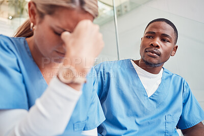 Buy stock photo Healthcare, collaboration or loss and a sad nurse in the hospital with a man colleague showing compassion. Medical, death and insurance with a black male medicine professional consoling a friend
