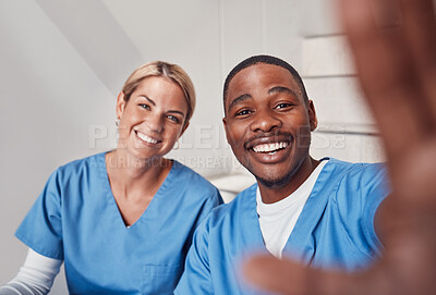 Buy stock photo Selfie, healthcare and collaboration with friends posing for a picture together in a hospital. Portrait, teamwork or diversity with a man and woman friend in medicine taking a photograph in a clinic