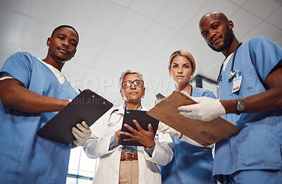 Buy stock photo Doctors, teamwork portrait and hospital management, checklist and healthcare analysis from patient pov. Nurses, medical professional or surgeon people in clinic check, review or feedback from below