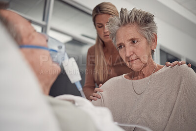 Buy stock photo Sad family, old woman and man in bed at hospital with ventilator for breathing, healthcare or support. Senior wife, husband and deathbed with cancer in lungs at clinic, mother and daughter solidarity