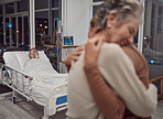 Hug, support and family at hospital with father lying in bed sick with cancer or illness. Sad, comfort and senior woman and girl hugging, embrace or cuddle for empathy, love and hope for life of man.