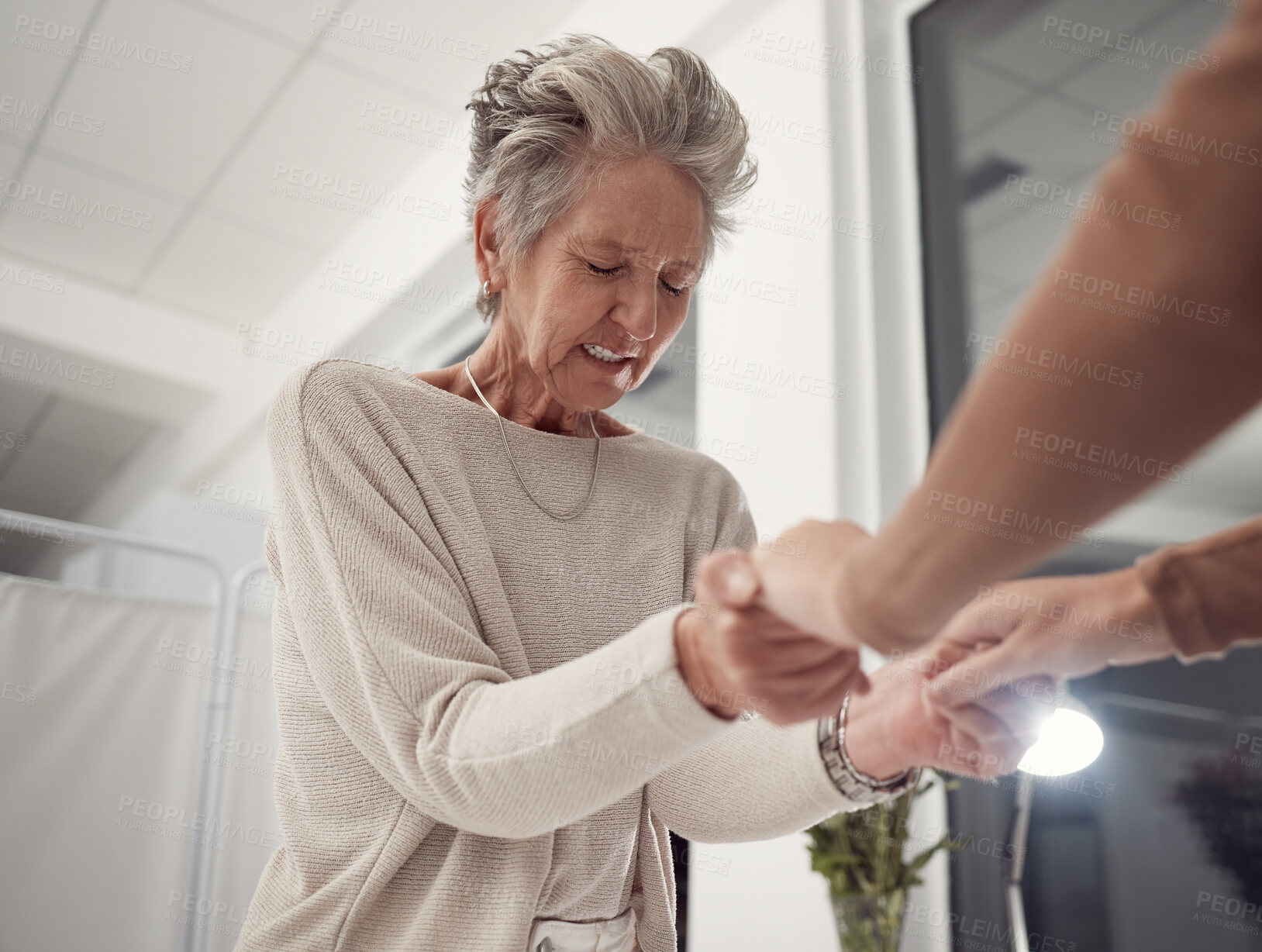 Buy stock photo Support, holding hands and prayer of woman at hospital for hope, healing or miracle. Christian, worship and family together for unity in crisis, cancer or bad news and comfort while praying at night.