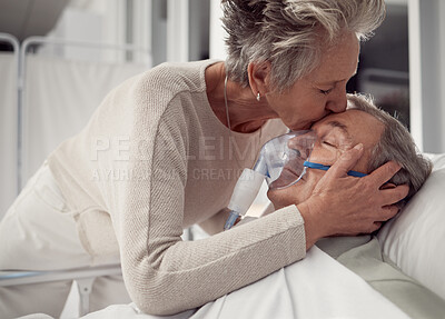 Buy stock photo Hospital, kiss and senior couple with love, unity and hope for recovery in clinic. Support, care and elderly woman kissing man or patient with cancer diagnosis, sick or illness for comfort or empathy