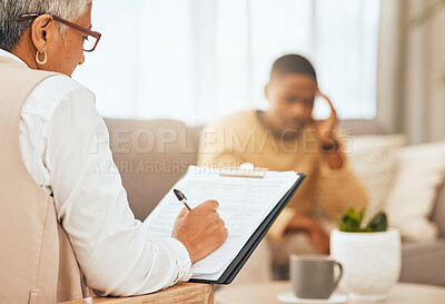 Buy stock photo Man on sofa, therapist writing notes on clipboard for mental health advice and consulting in office. Stress, anxiety and depression, sad person and psychologist in consultation room with patient.